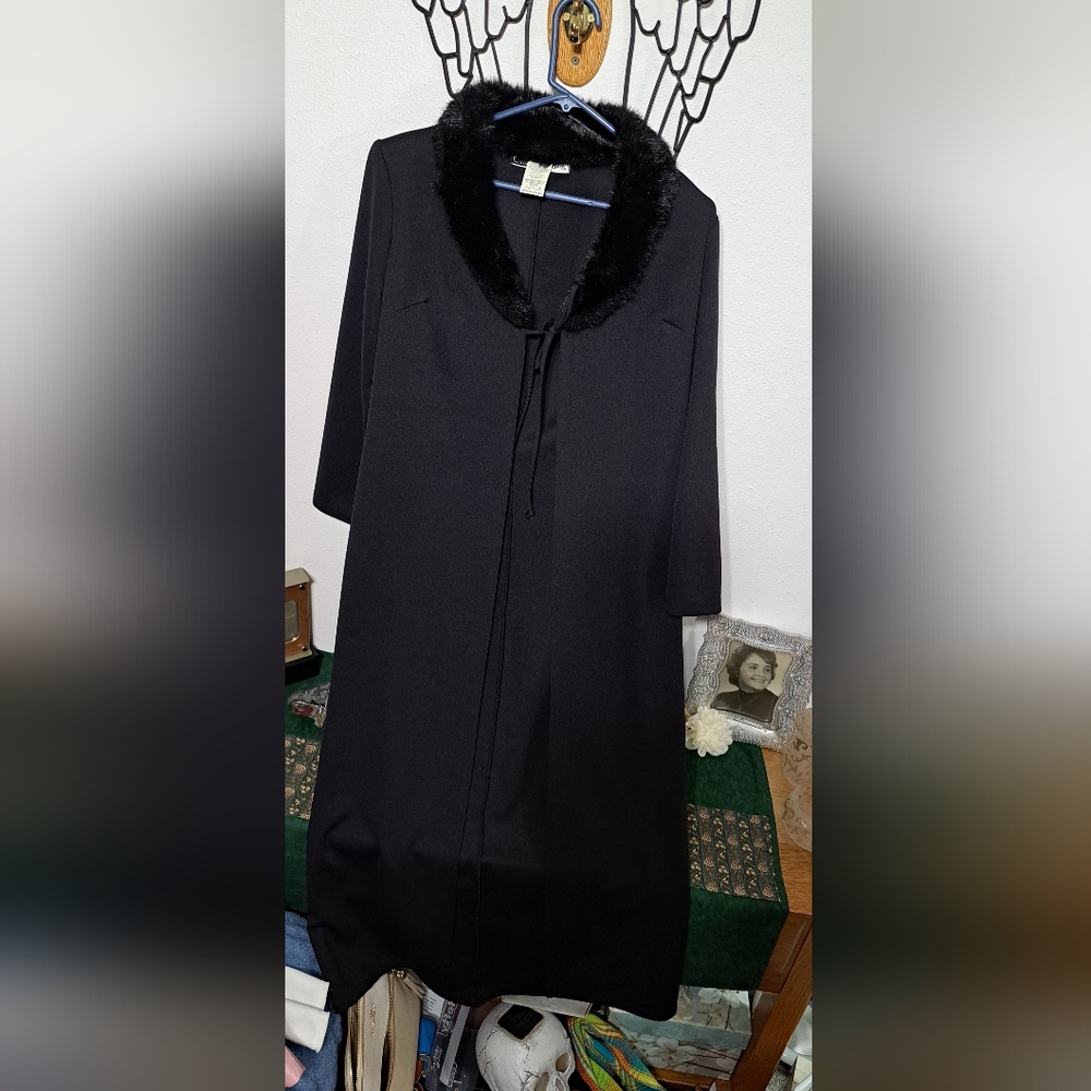 Elegant Women's long jacket with faux fur collar.